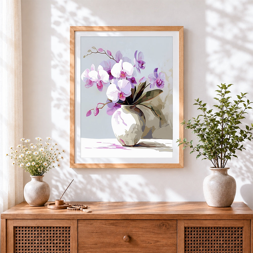 Finished pink and white orchids in a white vase cross stitch artwork displayed