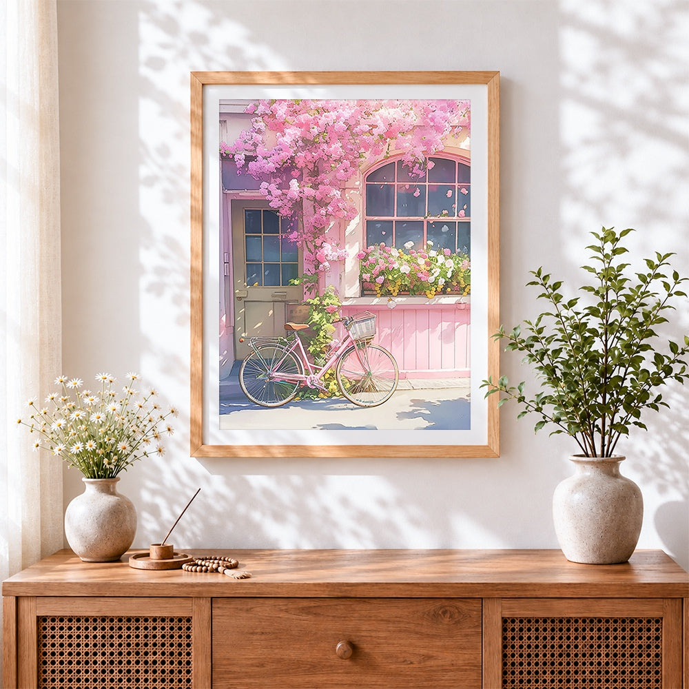 Finished pink blossom bicycle art cross stitch artwork displayed