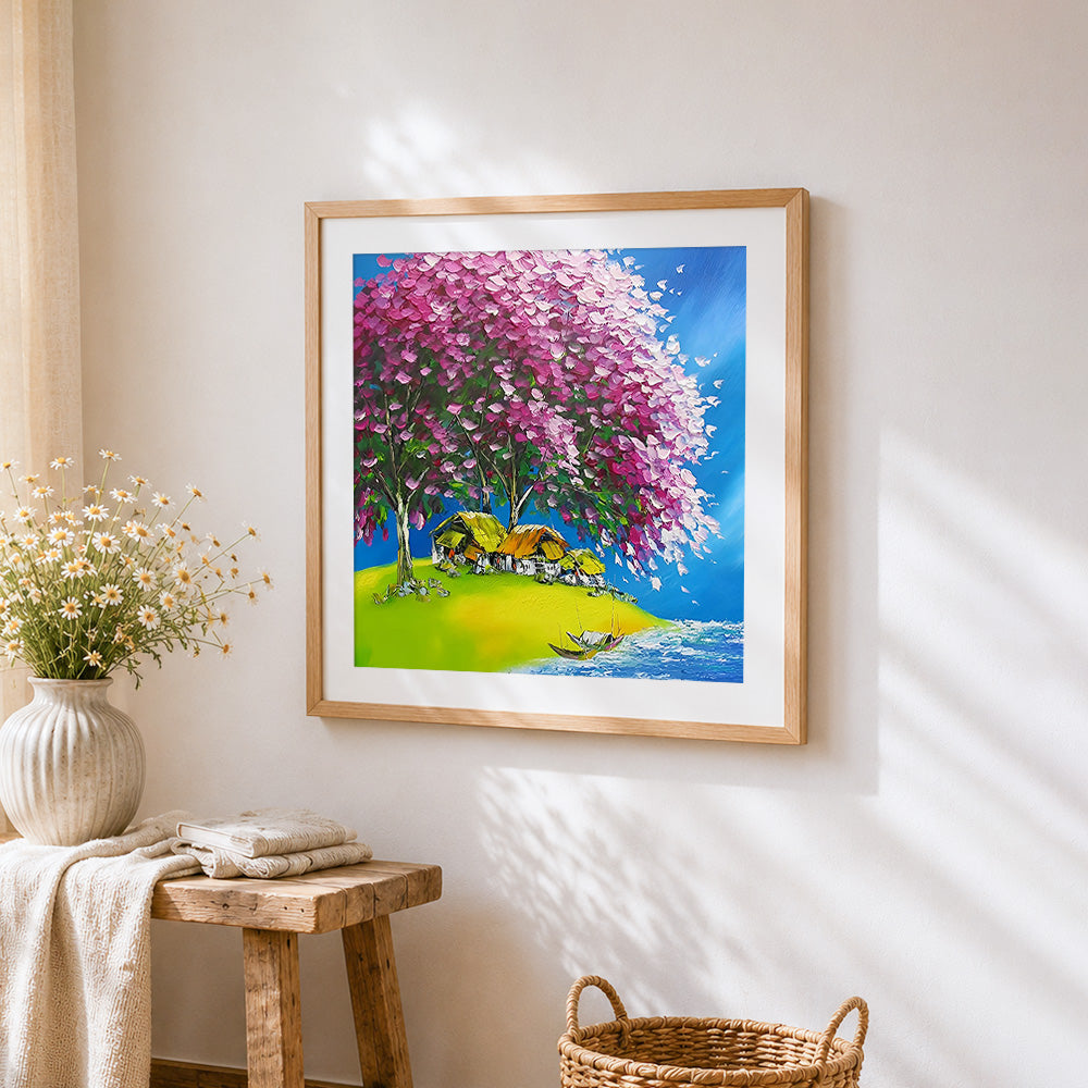 Pink blossom tree and lakeside village cross stitch artwork displayed on wall as home decor