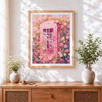 Finished pink british phone box and roses cross stitch artwork displayed