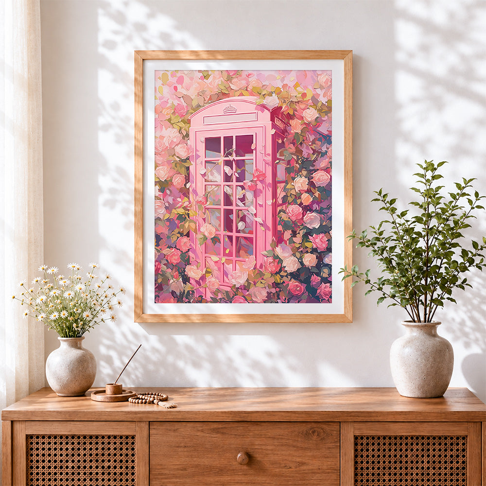 Finished pink british phone box and roses cross stitch artwork displayed