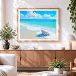 Finished pink conch shell on beach cross stitch artwork displayed