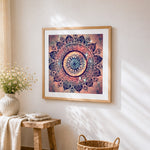 Pink cosmic mandala on starry background cross stitch artwork displayed on wall as home decor