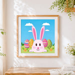 Finished pink easter bunny with colourful eggs cross stitch artwork displayed