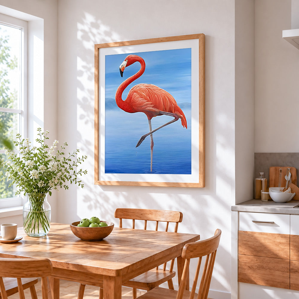Pink flamingo on blue water cross stitch artwork displayed on wall as home decor
