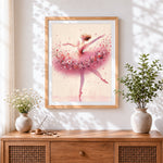 Finished pink floral ballerina cross stitch artwork displayed