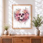 Finished pink floral watercolour skull cross stitch artwork displayed