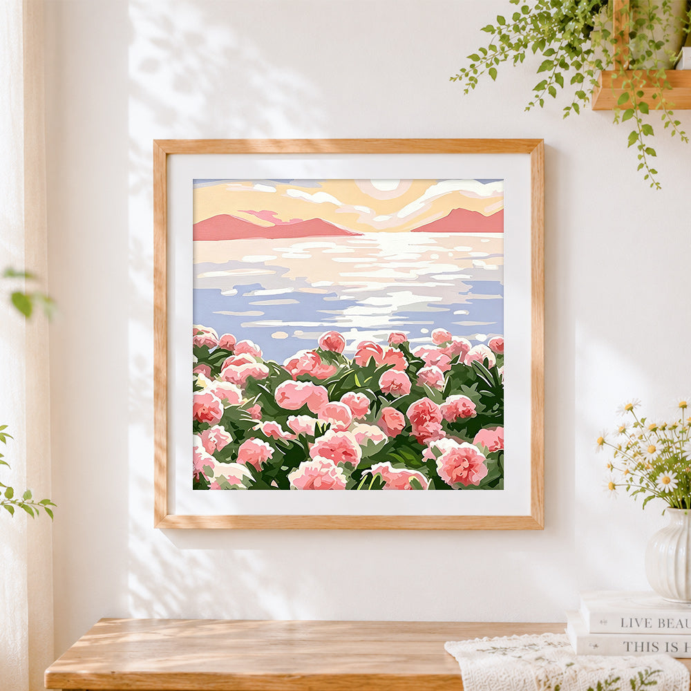 Finished pink flowers by the sea cross stitch artwork displayed