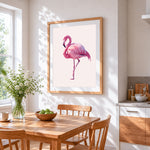 Pink geometric flamingo cross stitch artwork displayed on wall as home decor