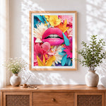 Finished pink lips surrounded by flowers cross stitch artwork displayed