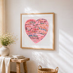 Pink multi language i love you heart cross stitch artwork displayed on wall as home decor