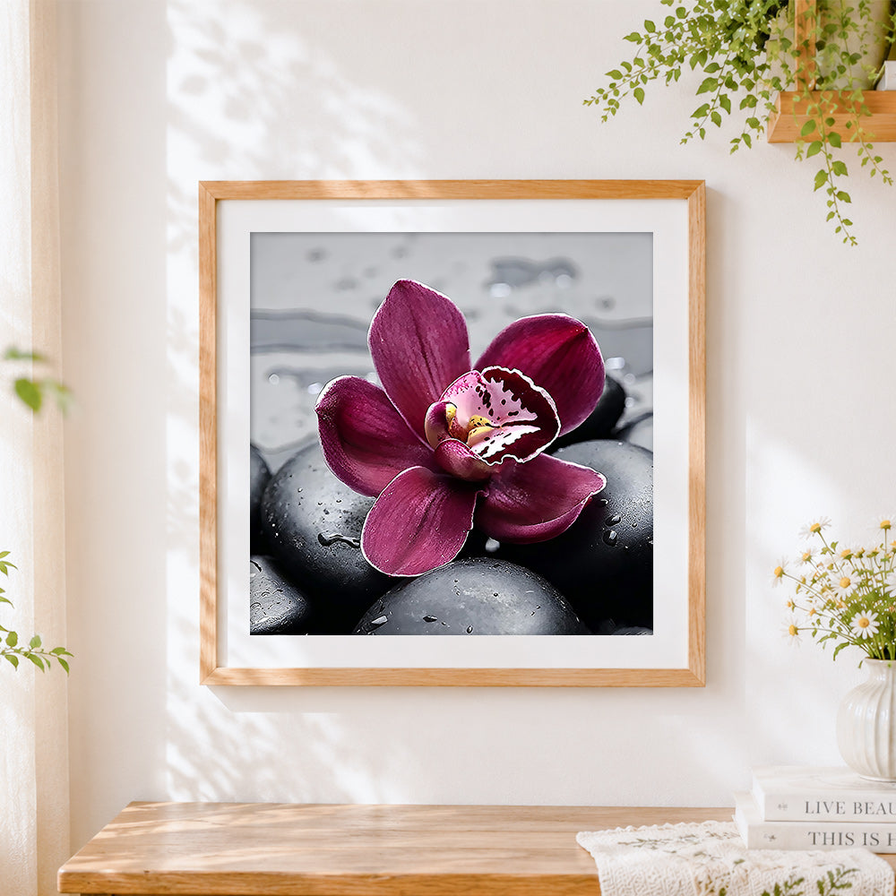Finished pink orchid on black stones paint by numbers artwork displayed as home decor