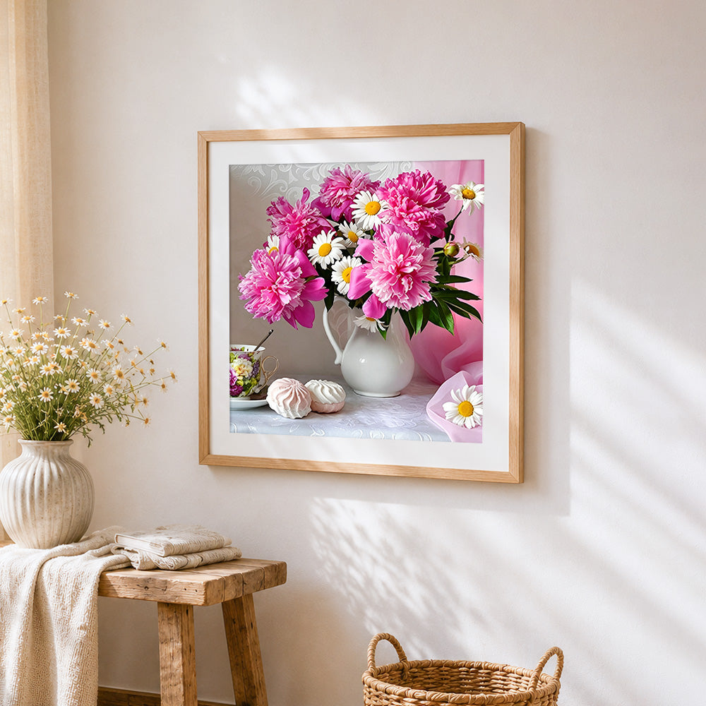 Pink peonies and white daisies cross stitch artwork displayed on wall as home decor