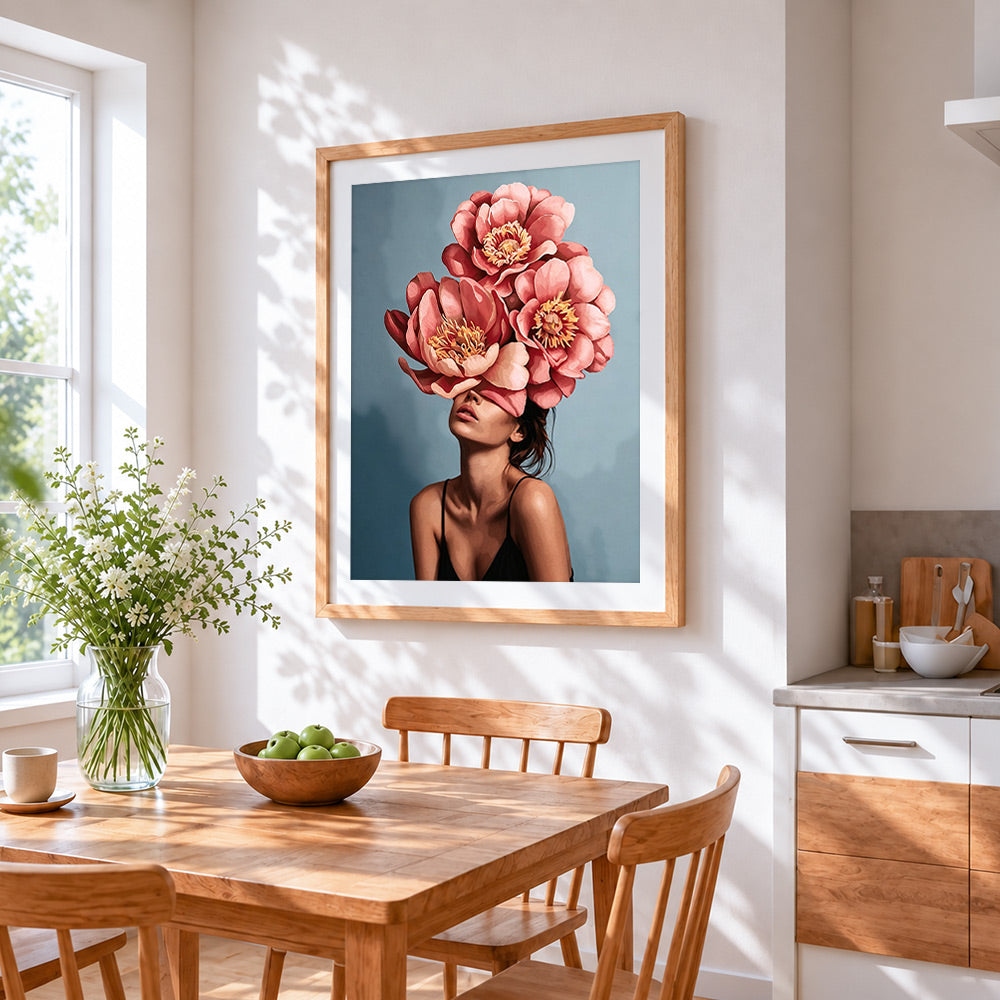Pink peony lady cross stitch artwork displayed on wall as home decor