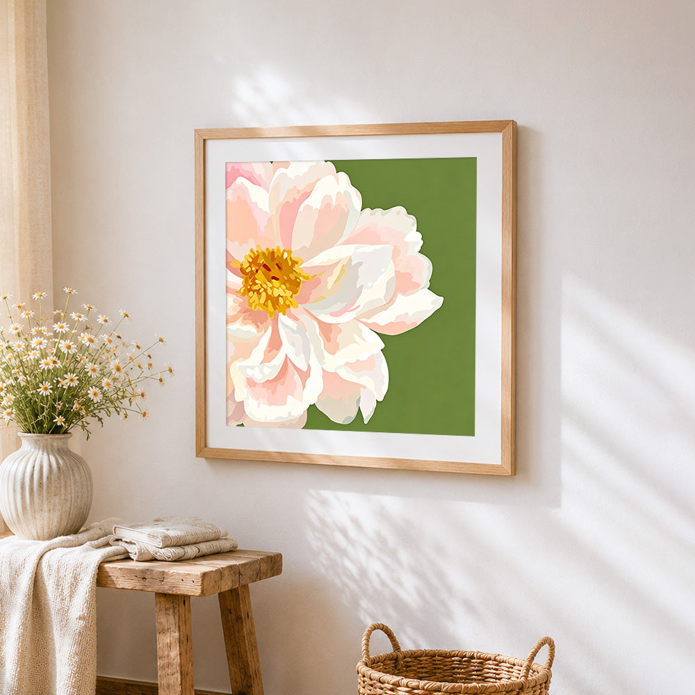 Pink peony on a green background cross stitch artwork displayed on wall as home decor