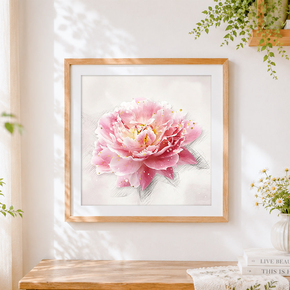 Finished pink peony with gold leaf splatter cross stitch artwork displayed