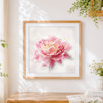 Finished pink peony with gold leaf splatter cross stitch artwork displayed