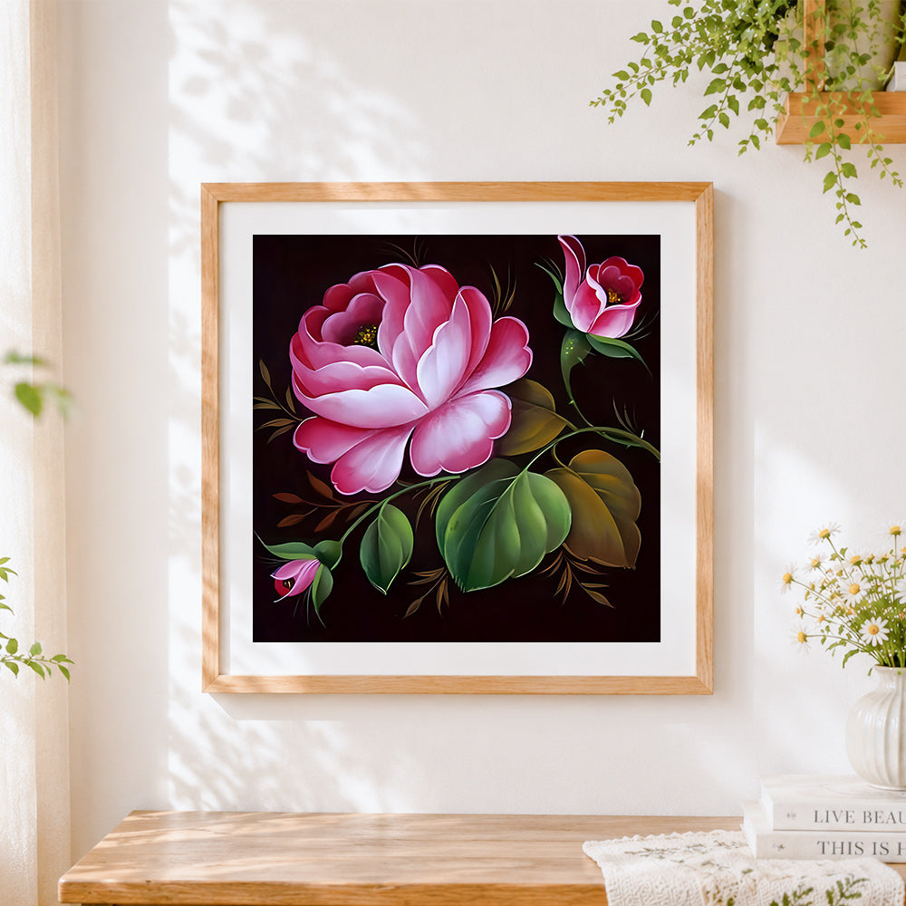 Finished pink rose and buds on dark background cross stitch artwork displayed