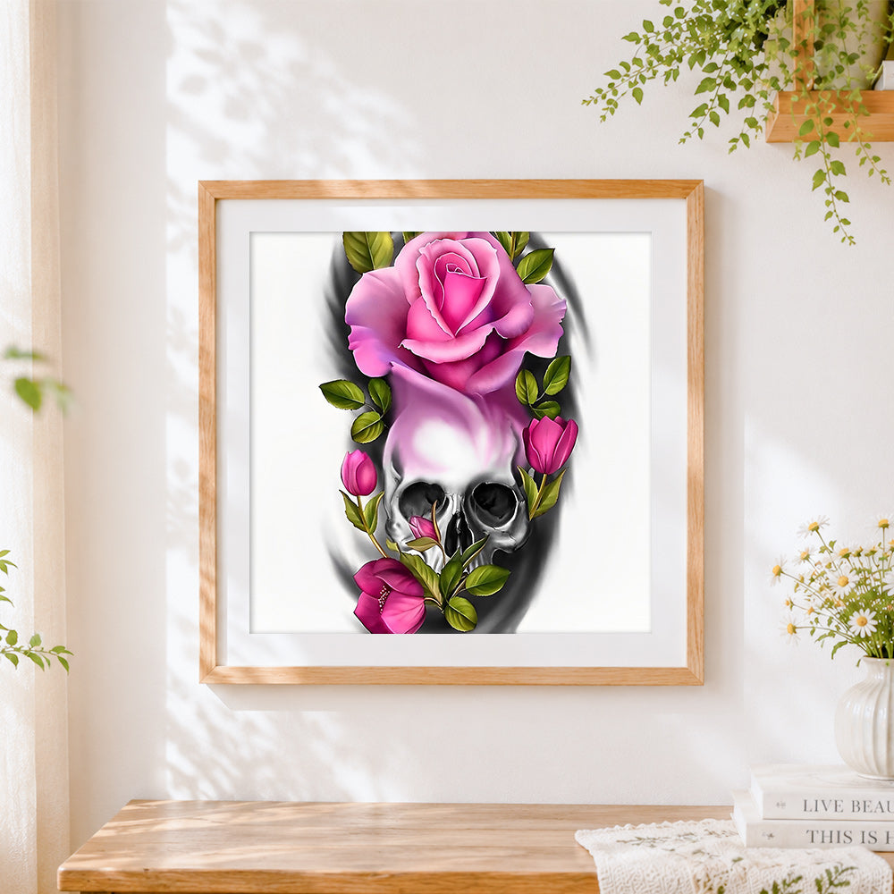 Finished pink roses and grey skull cross stitch artwork displayed
