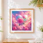Finished pink roses in a heart cloud cross stitch artwork displayed