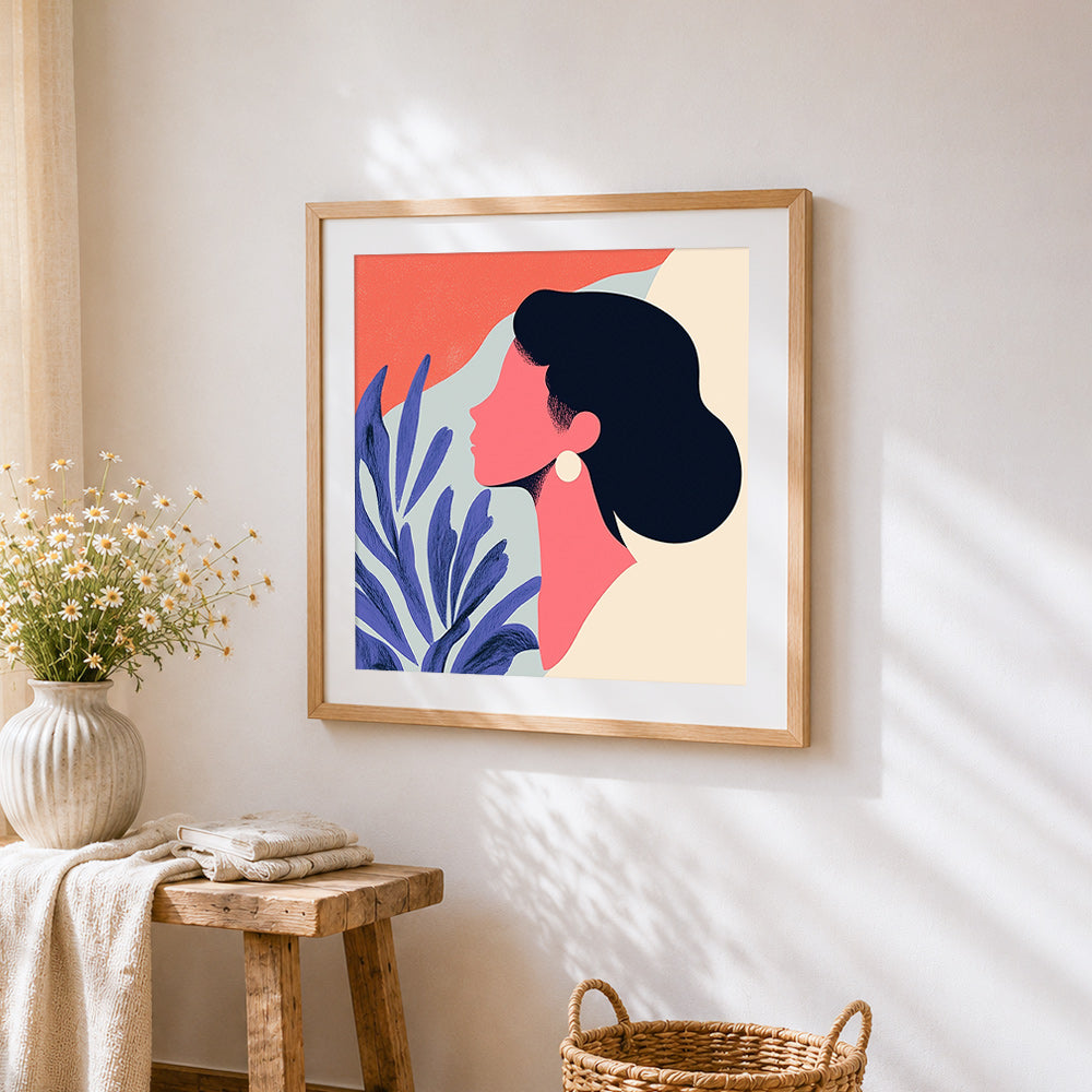 Pink silhouette and blue botanicals cross stitch artwork displayed on wall as home decor