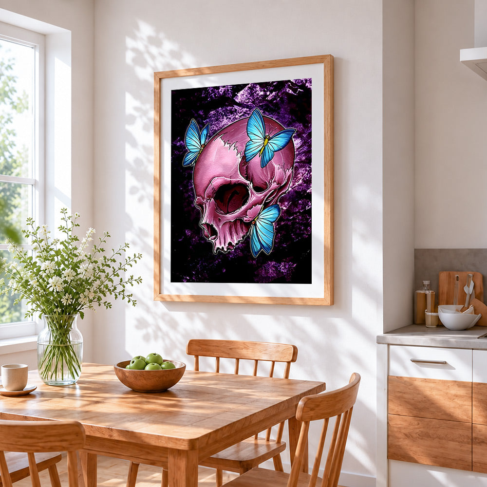 Pink skull with blue butterflies cross stitch artwork displayed on wall as home decor
