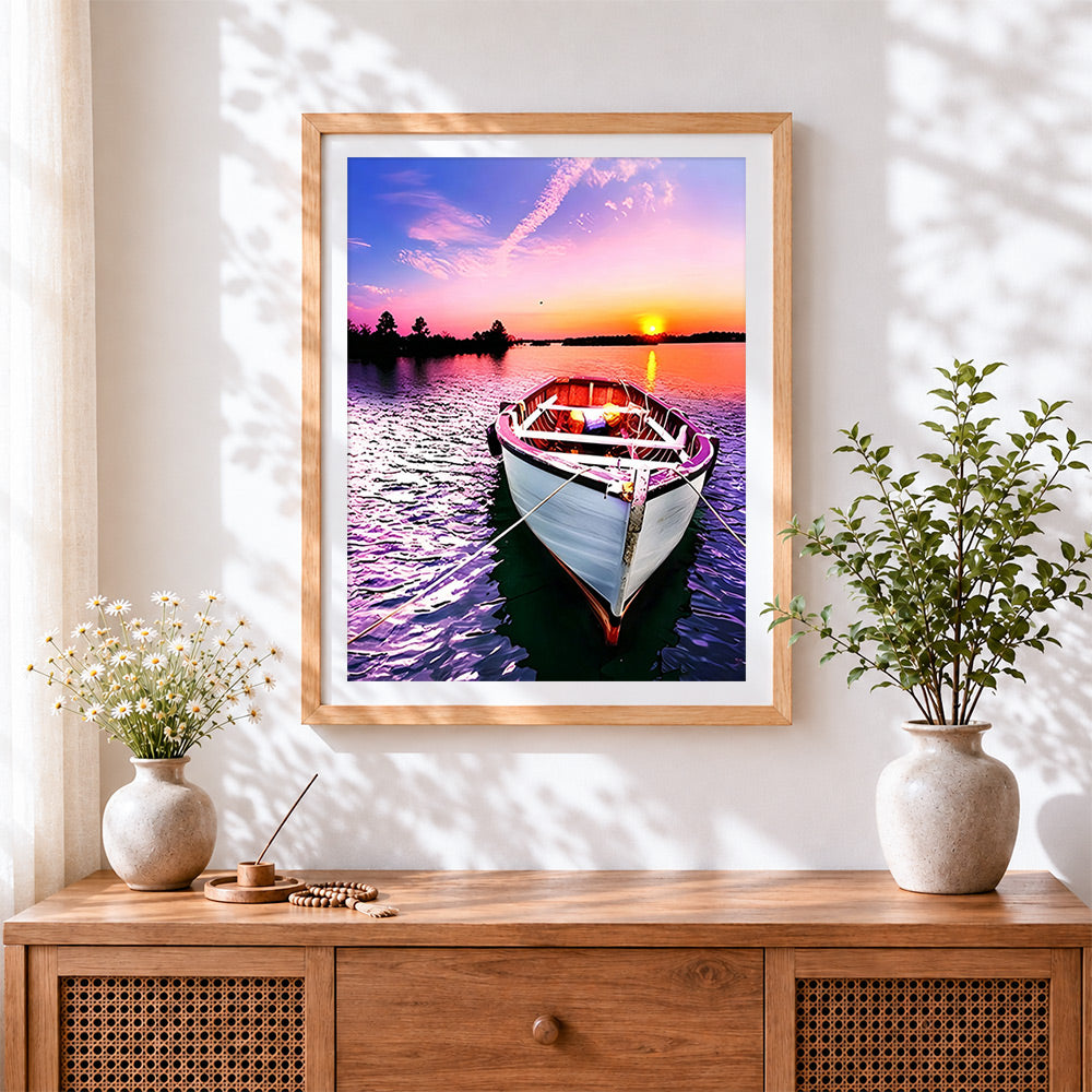 Finished pink sunset boat cross stitch artwork displayed
