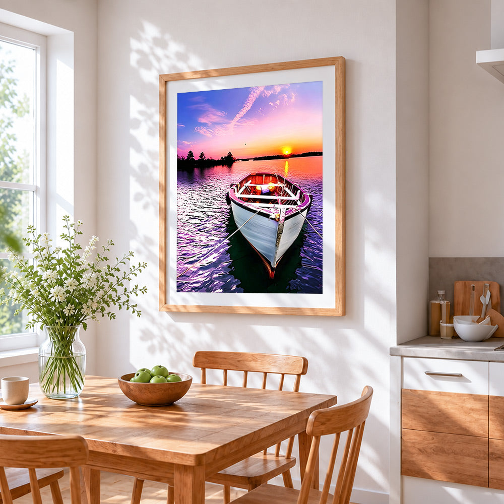 Pink sunset boat cross stitch artwork displayed on wall as home decor