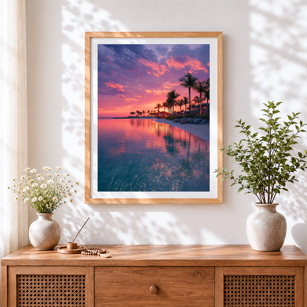 Finished pink sunset lagoon and palm trees cross stitch artwork displayed