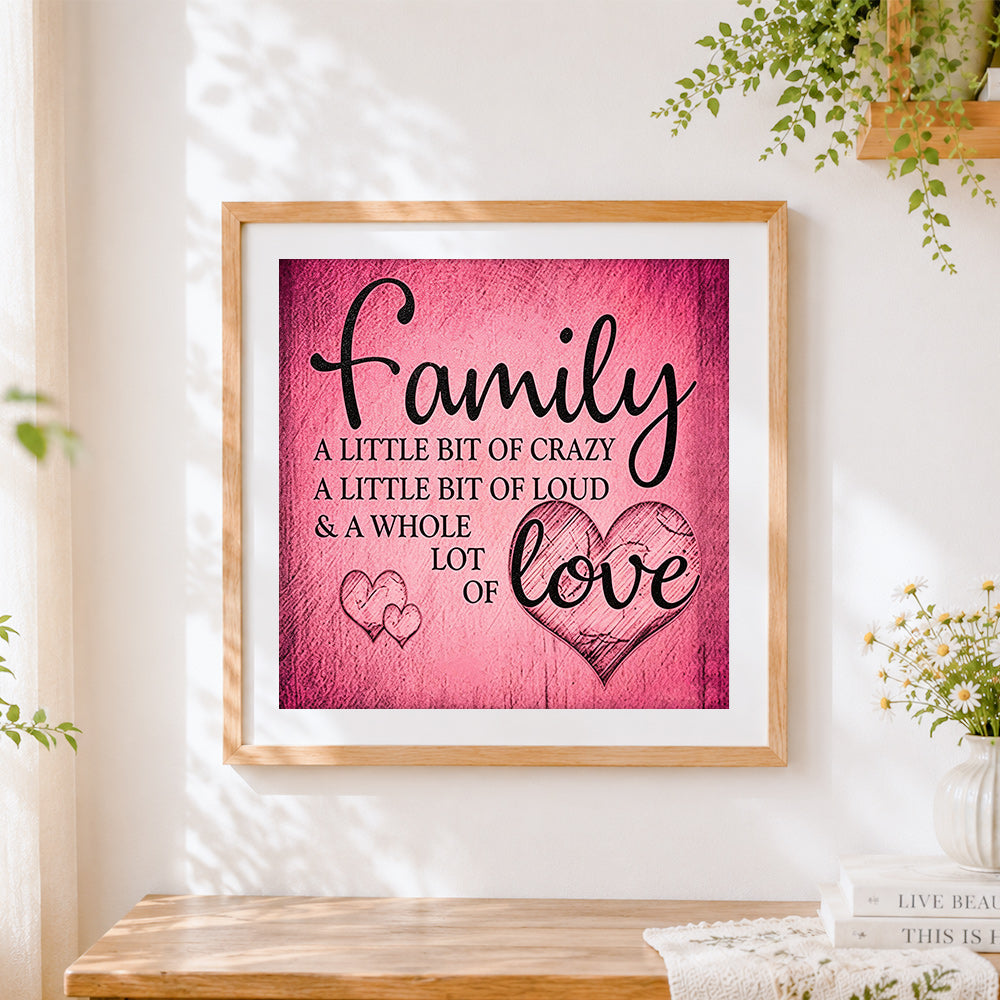 Finished pink texture family and love quote cross stitch artwork displayed