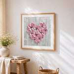 Pink textured floral heart paint by numbers artwork displayed on wall as home decor