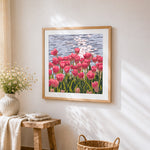 Pink tulips by the water cross stitch artwork displayed on wall as home decor