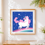 Finished pink unicorn galloping in the stars cross stitch artwork displayed