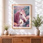 Finished pink unicorn in floral garden cross stitch artwork displayed