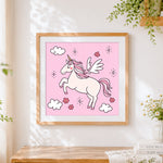 Finished pink unicorn with wings cross stitch artwork displayed