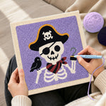 Creating handmade pirate skeleton punch needle artwork