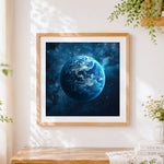 Finished planet earth in starry space cross stitch artwork displayed