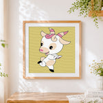 Finished playful baby goat cross stitch artwork displayed