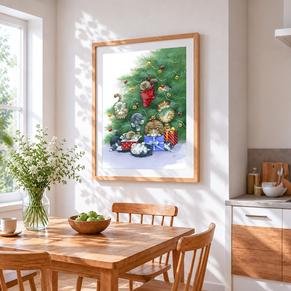 Playful kittens hiding in a christmas tree cross stitch artwork displayed on wall as home decor