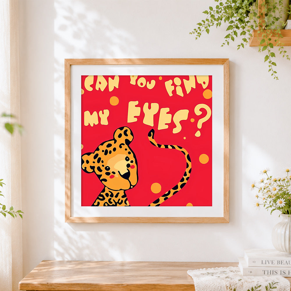 Finished playful leopard "can you find my eyes?" cross stitch artwork displayed