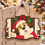 Pointing santa dog paint by numbers door hanger on a garden gate