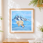 Finished polar bear and penguin in snow cross stitch artwork displayed