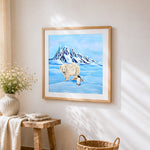 Polar bear and penguin in snow cross stitch artwork displayed on wall as home decor