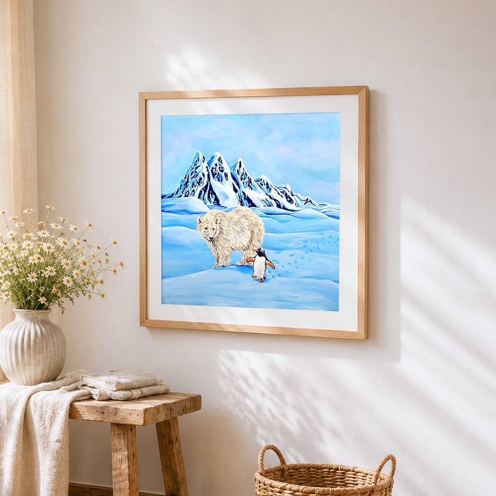 Polar bear and penguin in snow cross stitch artwork displayed on wall as home decor