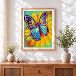 Finished pop art butterfly and sunflower cross stitch artwork displayed