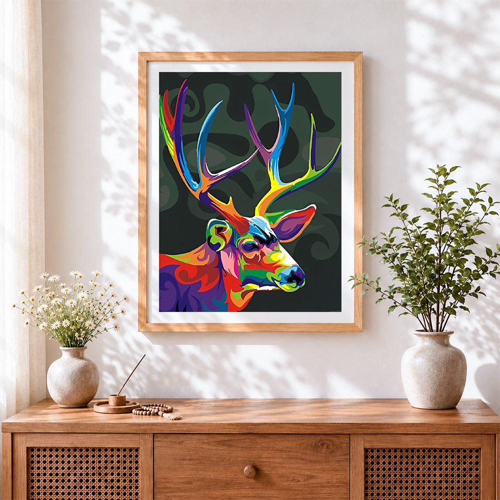 Finished pop art colourful stag cross stitch artwork displayed
