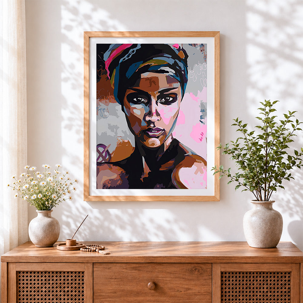 Finished pop art style african woman cross stitch artwork displayed
