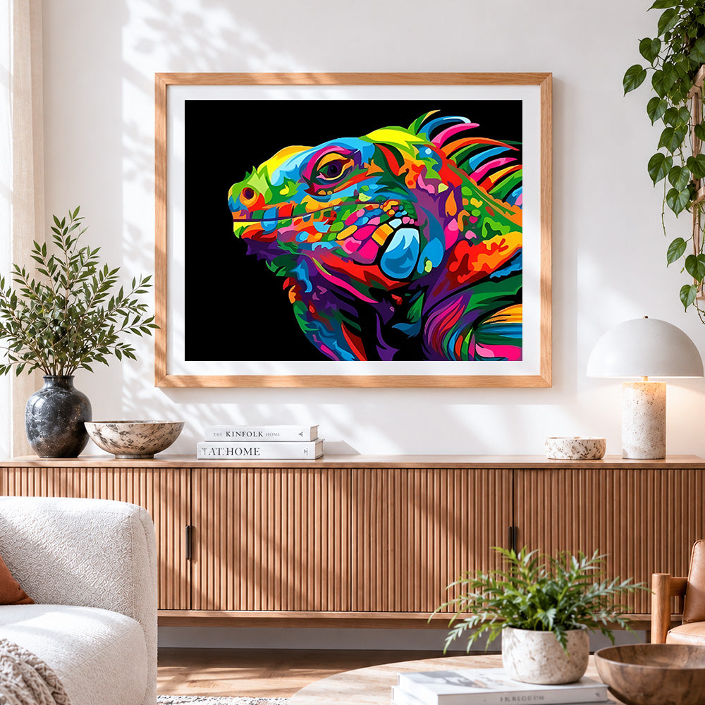 Finished pop art style chameleon head cross stitch artwork displayed