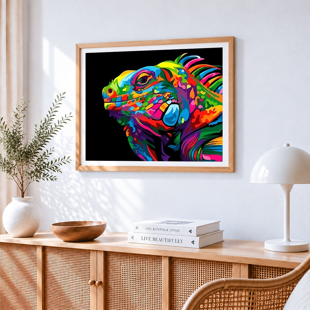 Pop art style chameleon head cross stitch artwork displayed on wall as home decor