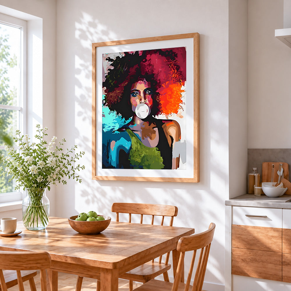 Pop art woman blowing bubblegum cross stitch artwork displayed on wall as home decor